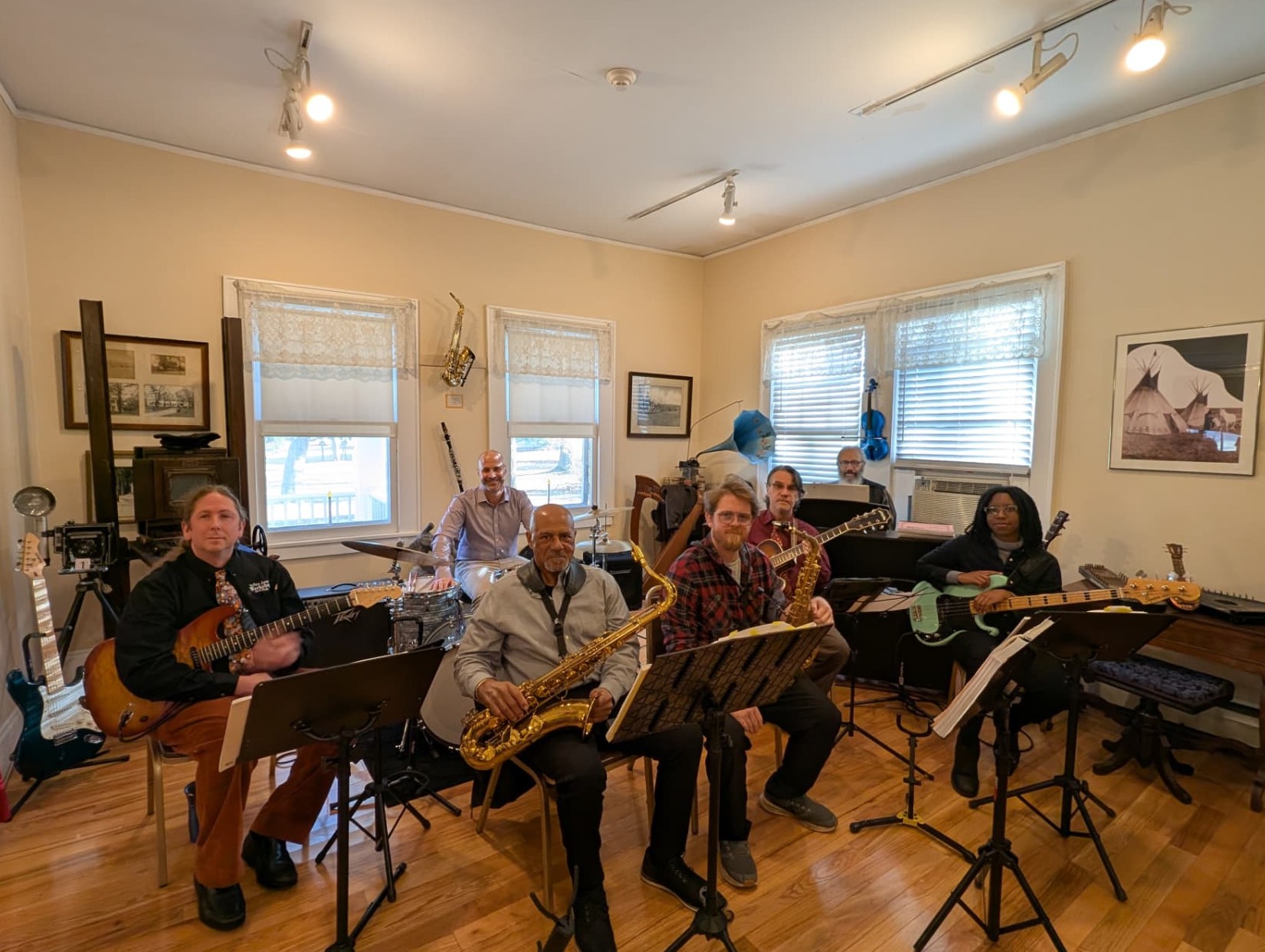 The NJWA Jazz Band rehearsing in a workshop room with saxes, guitars, drums and piano