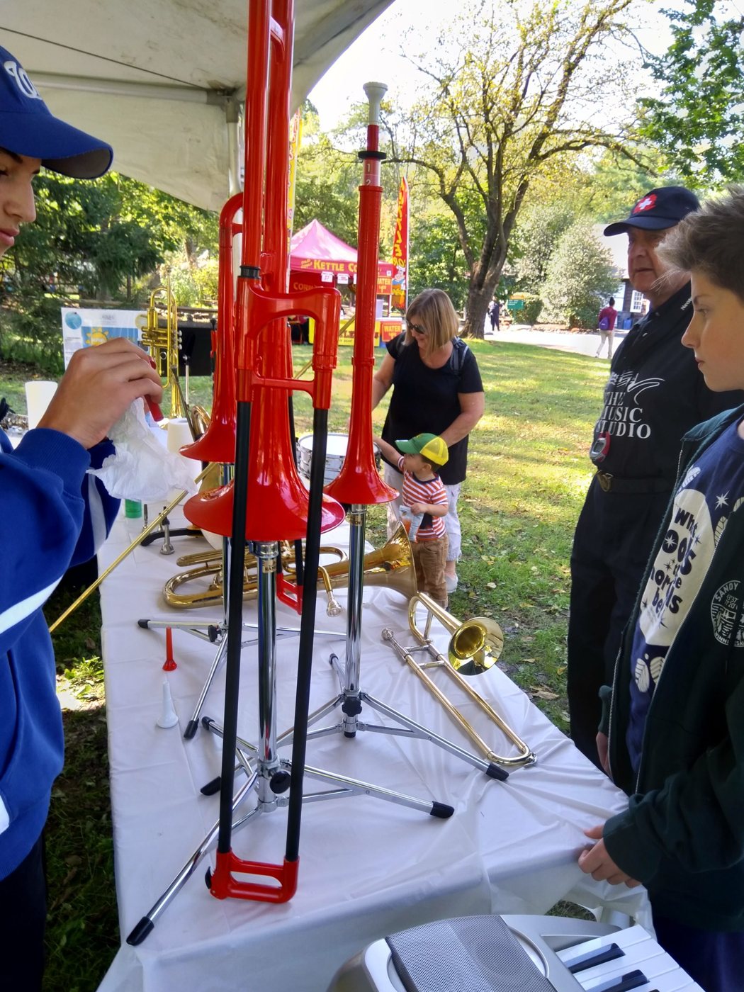 An NJWA teacher leading a free hands-on music workshop at a local fair