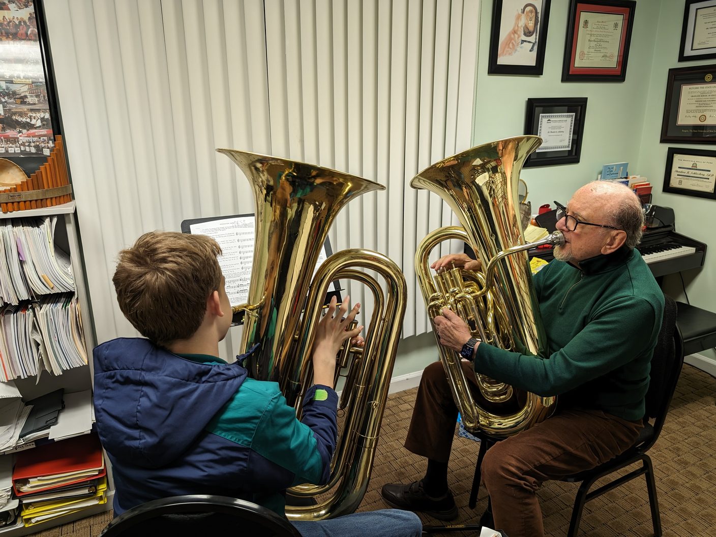 A NJWA student and teacher playing tubas together in a lesson studio